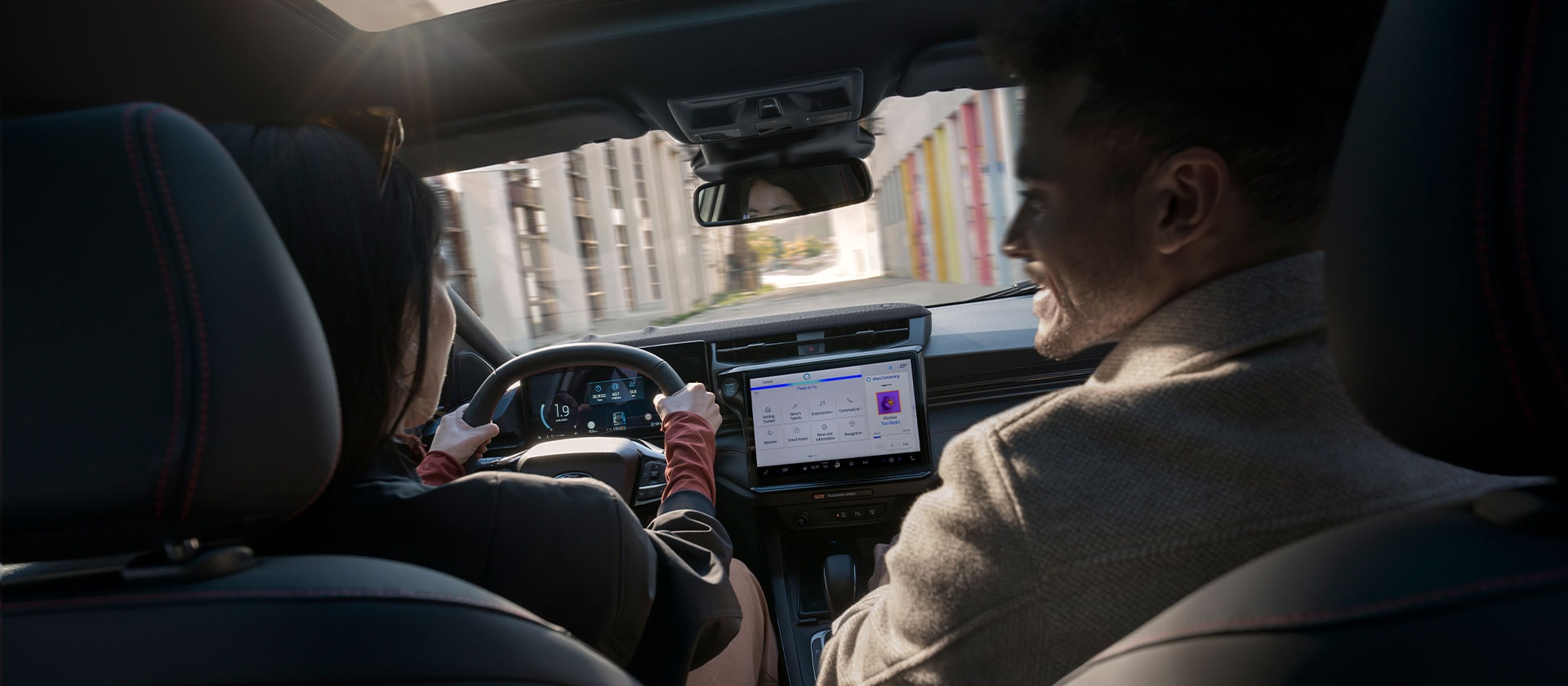 People sitting in Ford Puma® with interior view